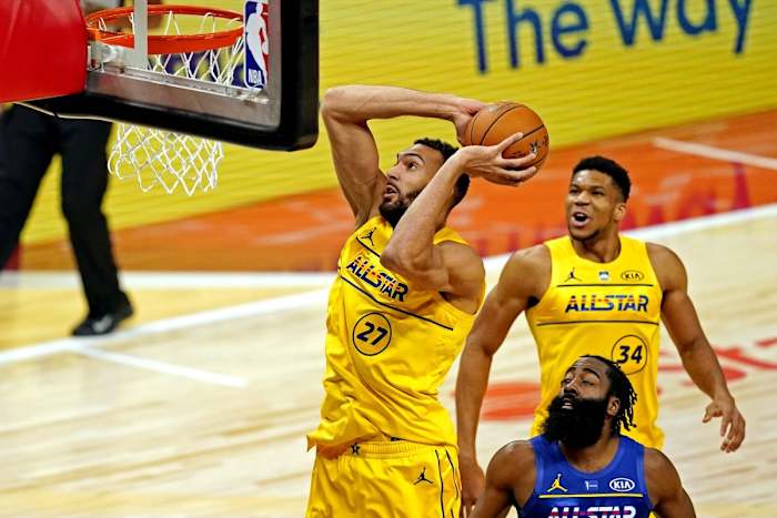Rudy Gobert (27) dunks over James Harden (blue) during the 2021 ASG